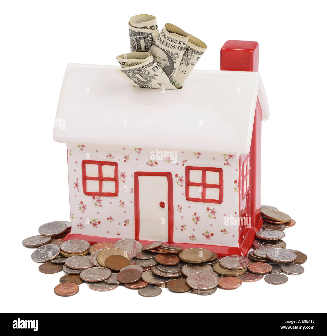 House shaped piggy bank with US dollar coins and notes Stock Photo