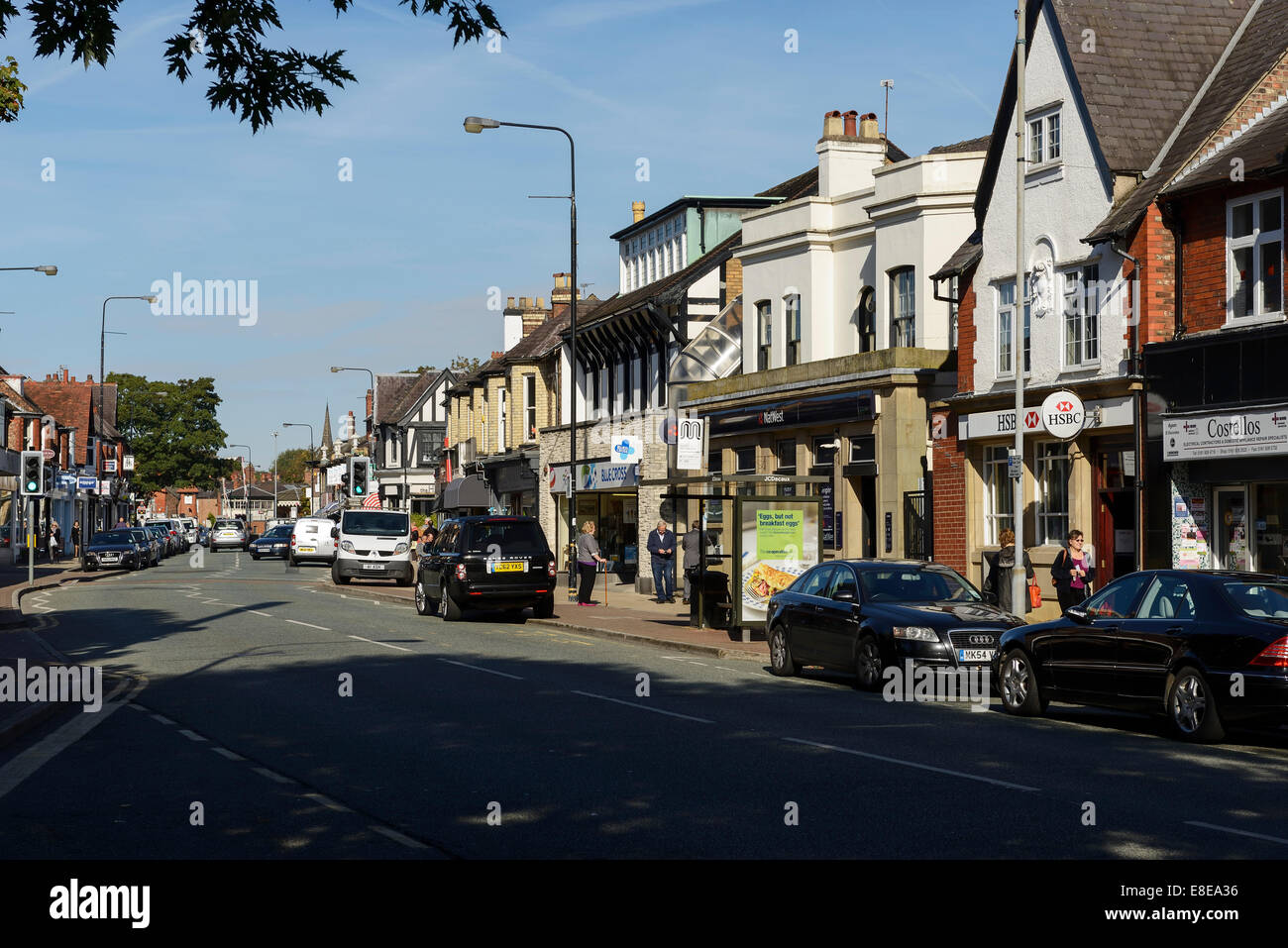 Shops and businesses on Ashley Road in the centre of Hale village Greater Manchester UK Stock Photo