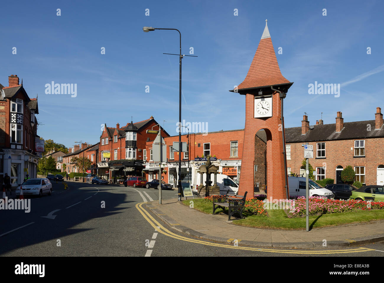 The Millennium clock tower in the centre of Hale village Greater Manchester UK Stock Photo