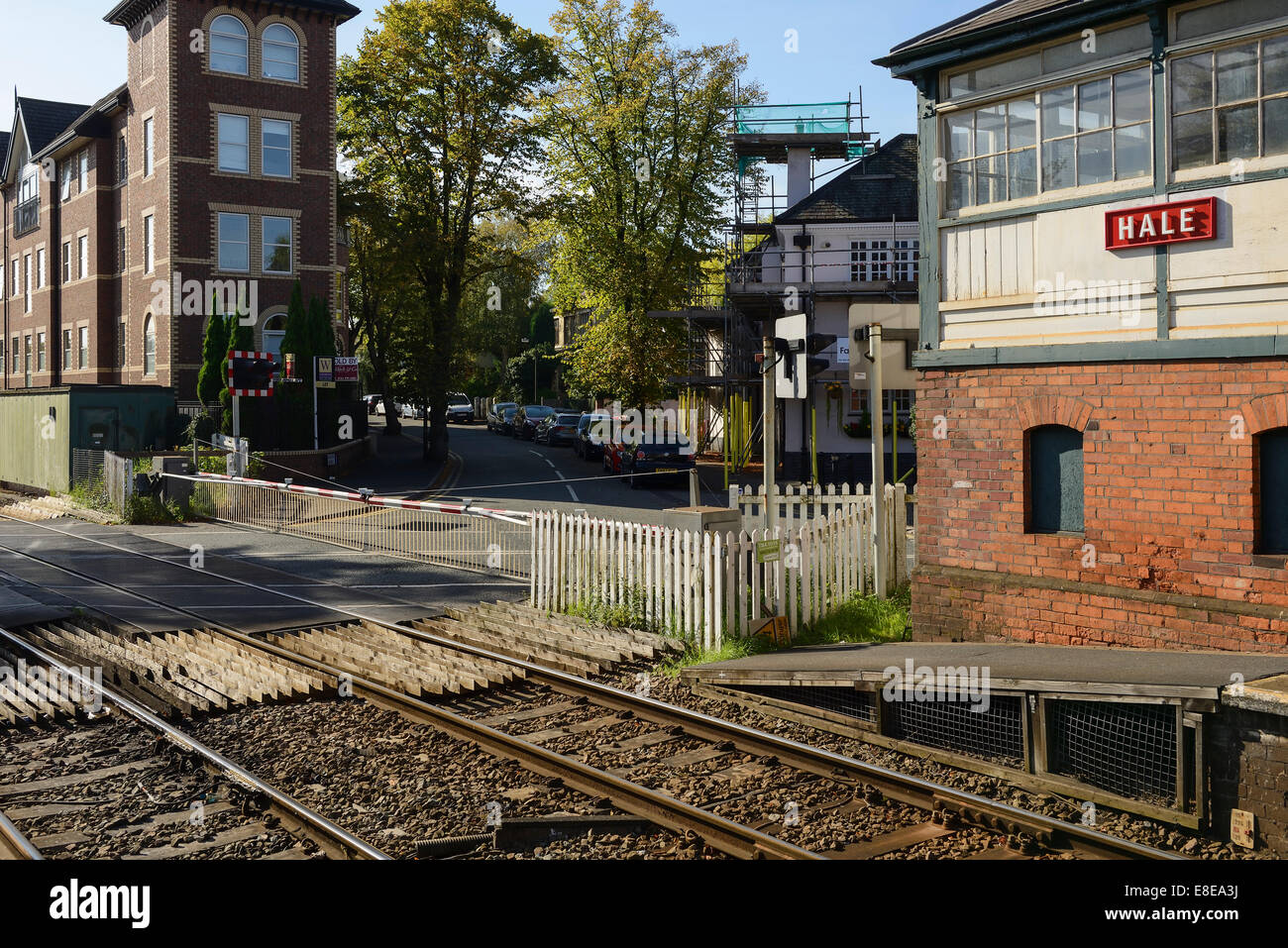 The level crossing and signal box on Ashley Road in Hale Greater Manchester UK Stock Photo