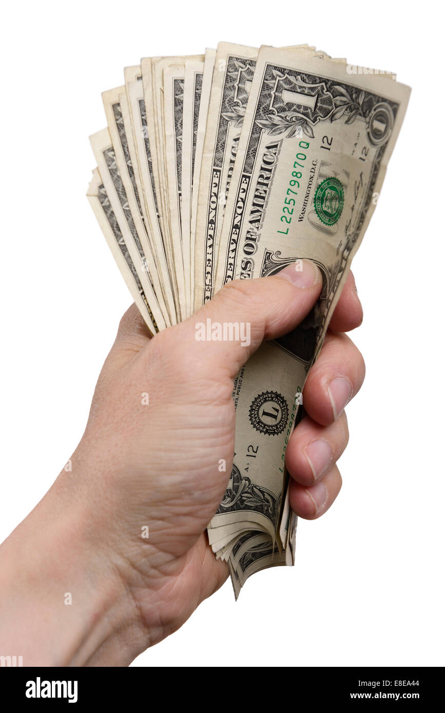 Mans hand holding a bundle of US One Dollar Bills Stock Photo