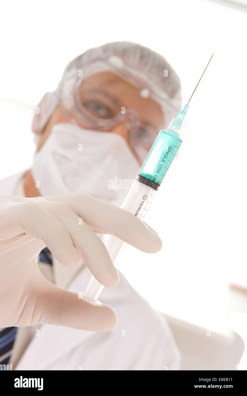 Scientist with a syringe Stock Photo