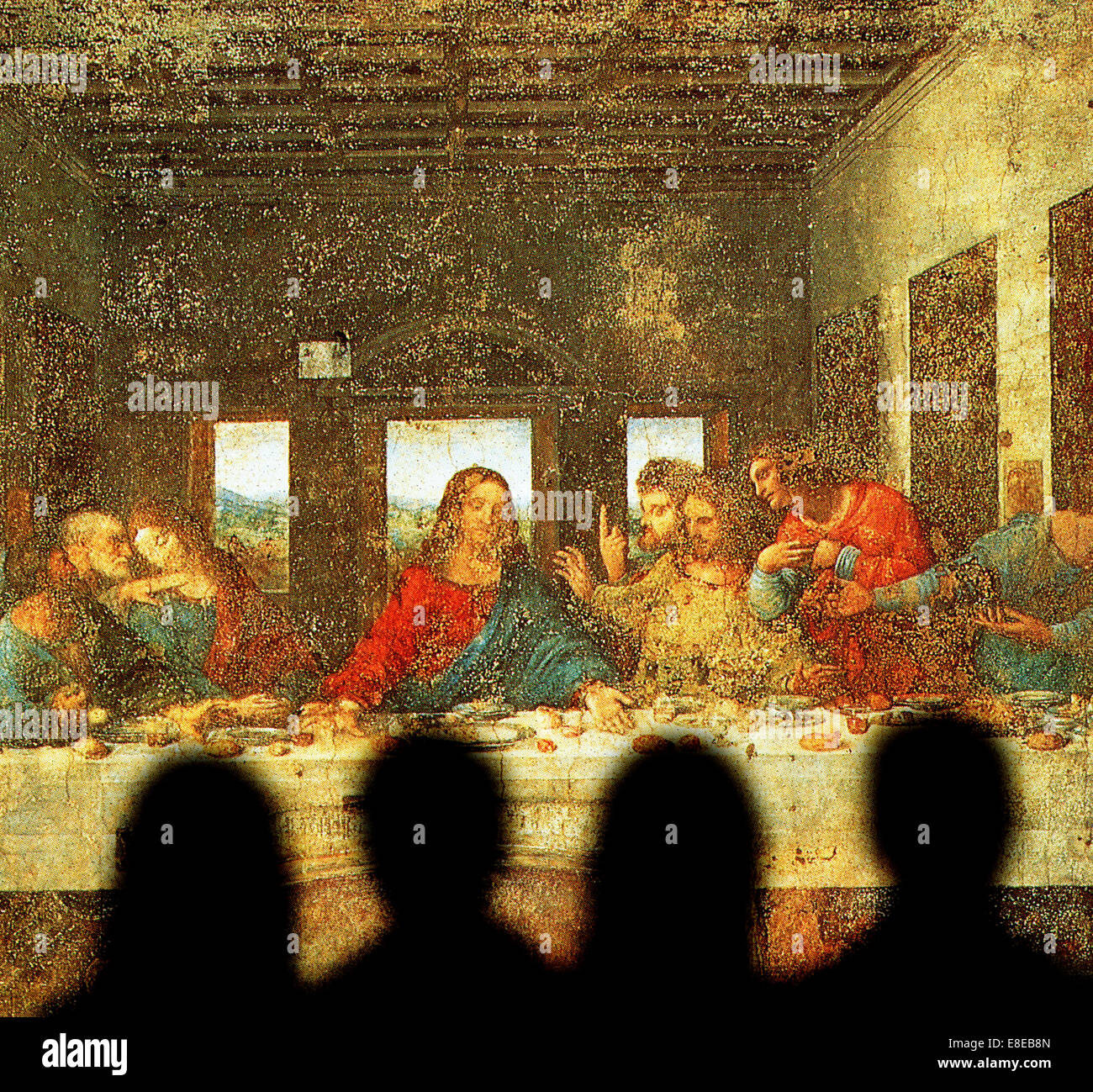 four tourists viewing Leonardo da Vinci's painting Last Supper Stock Photo