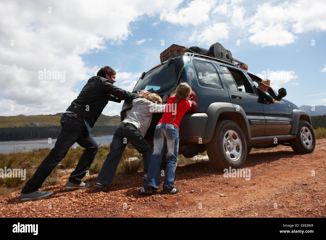 kids pushing car