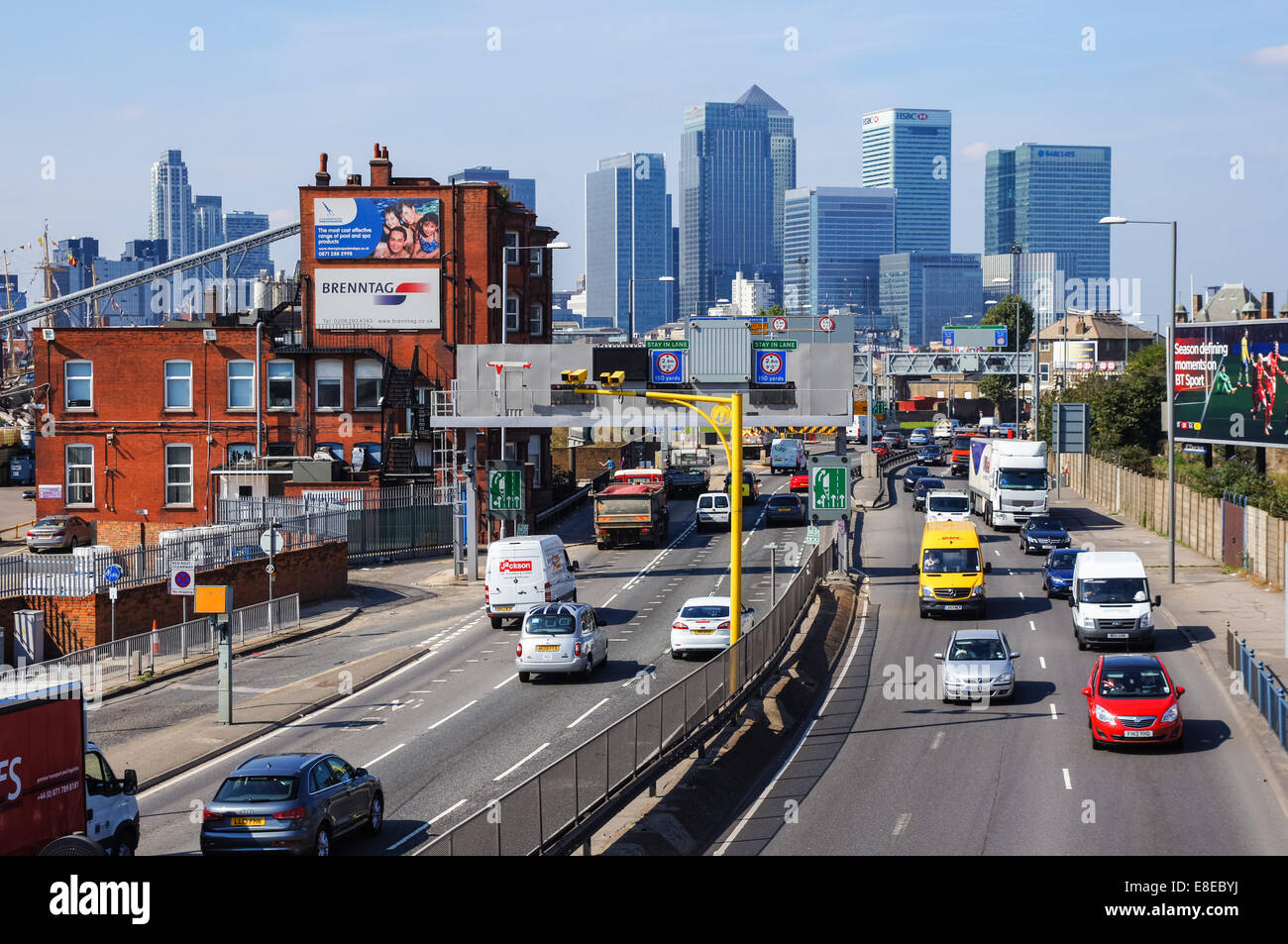 Traffic on A102 Blackwall Tunnel Approach with Canary Wharf skyscrapers