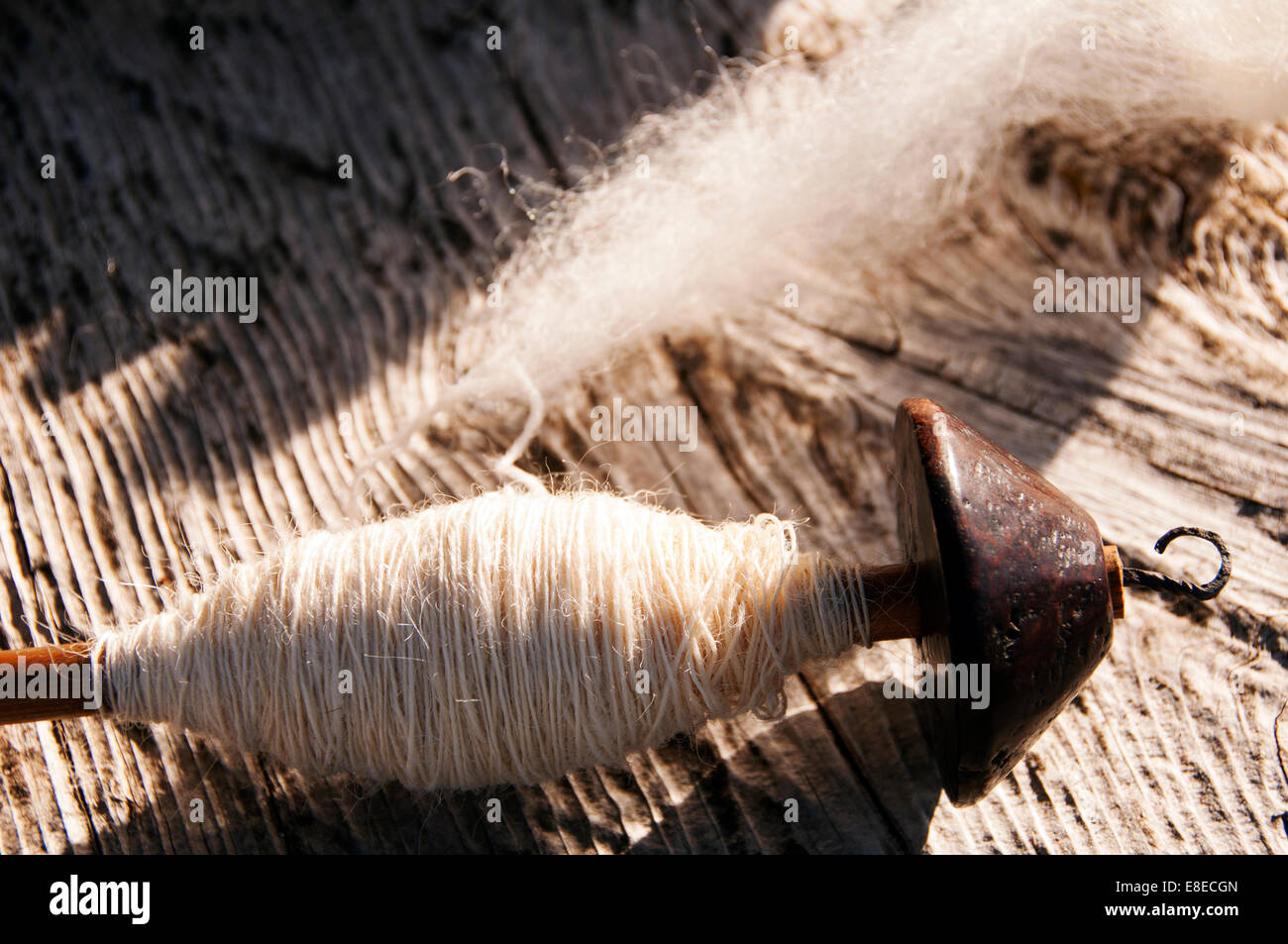 Old wool spindle and virgin wool Stock Photo Alamy