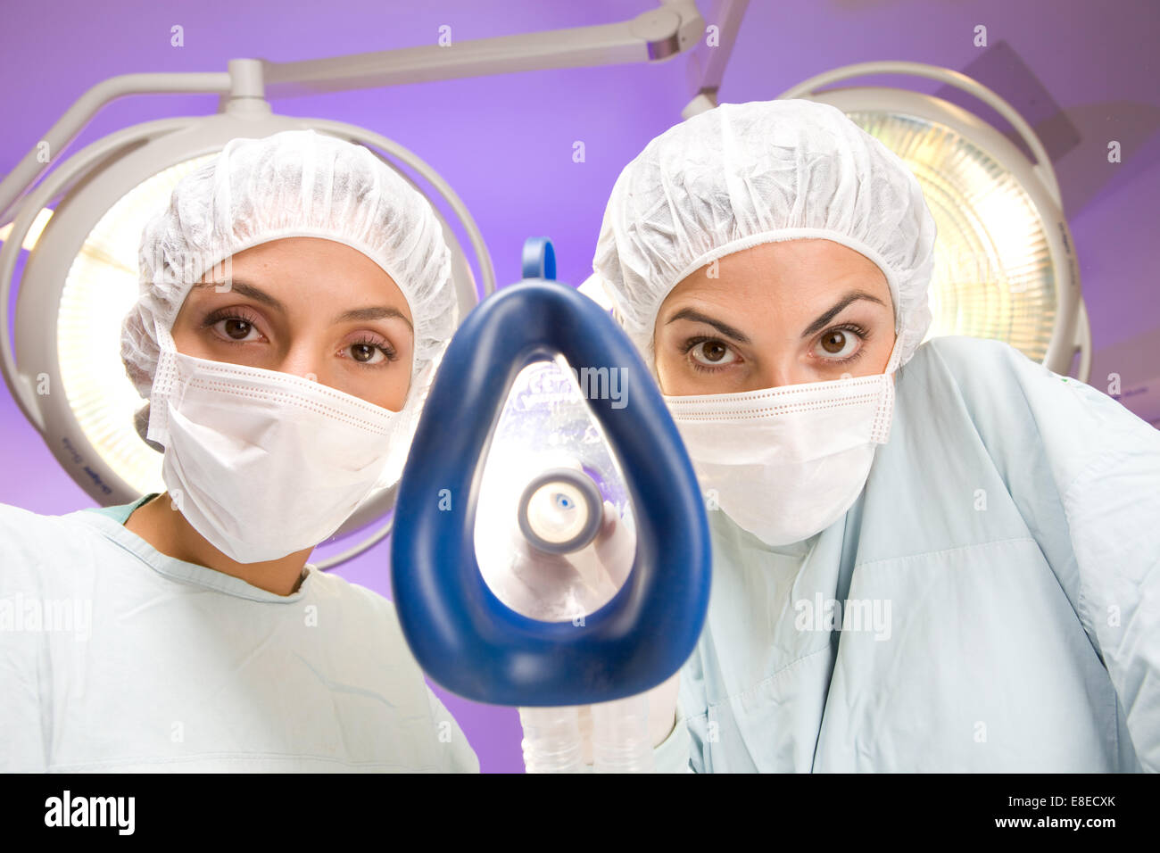 Anesthesiologist putting an oxygen mask on Stock Photo