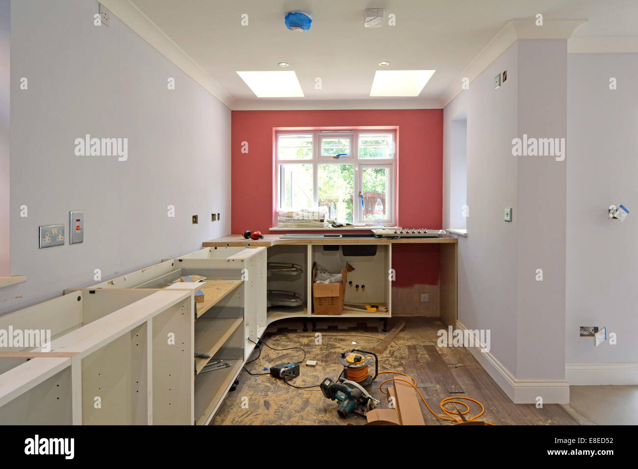 Kitchen fitters tools new cabinets and worktops being installed in new extension to detached house Essex England UK see 'More Info' note below Stock Photo