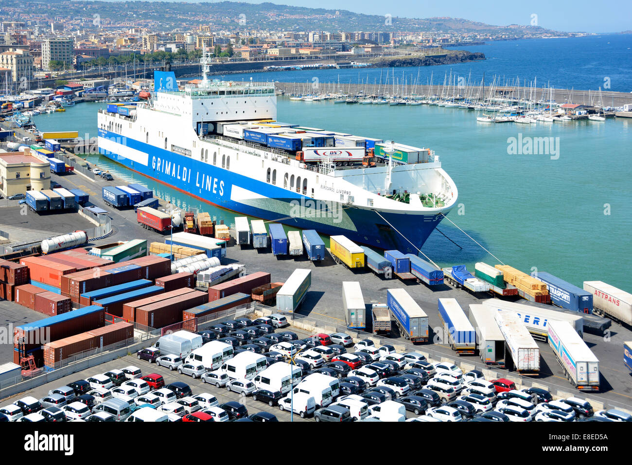 Aerial view new cars & vans port business dockside jetty Grimaldi Lines "Eurocargo Livorno" top deck loading lorry truck trailers Sicily Italy Stock Photo Alamy
