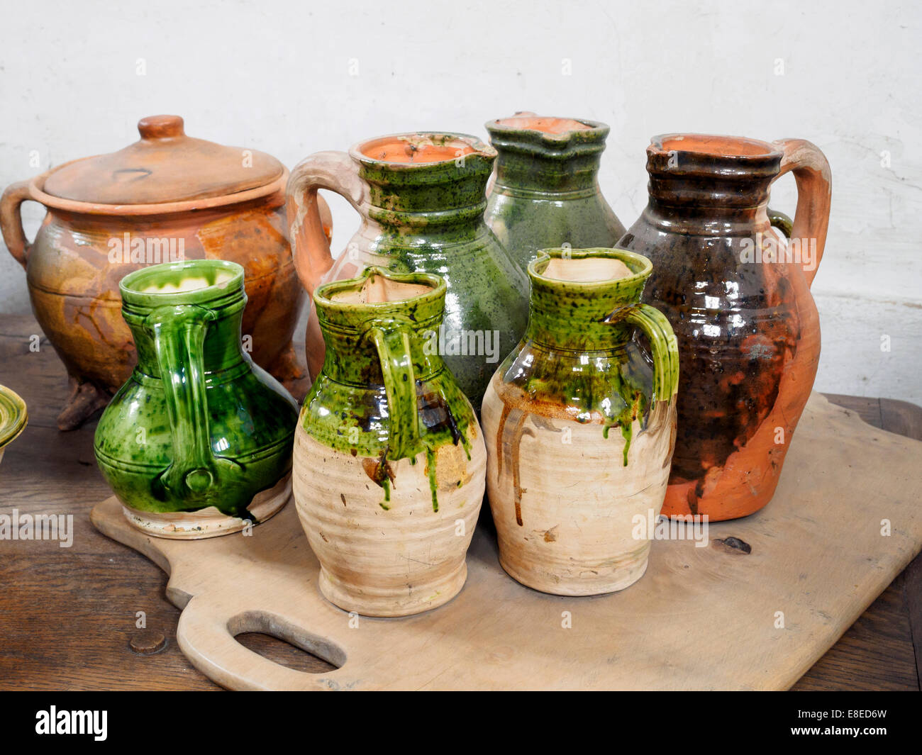 Jugs in one of the Hampton Court kitchens - England Stock Photo