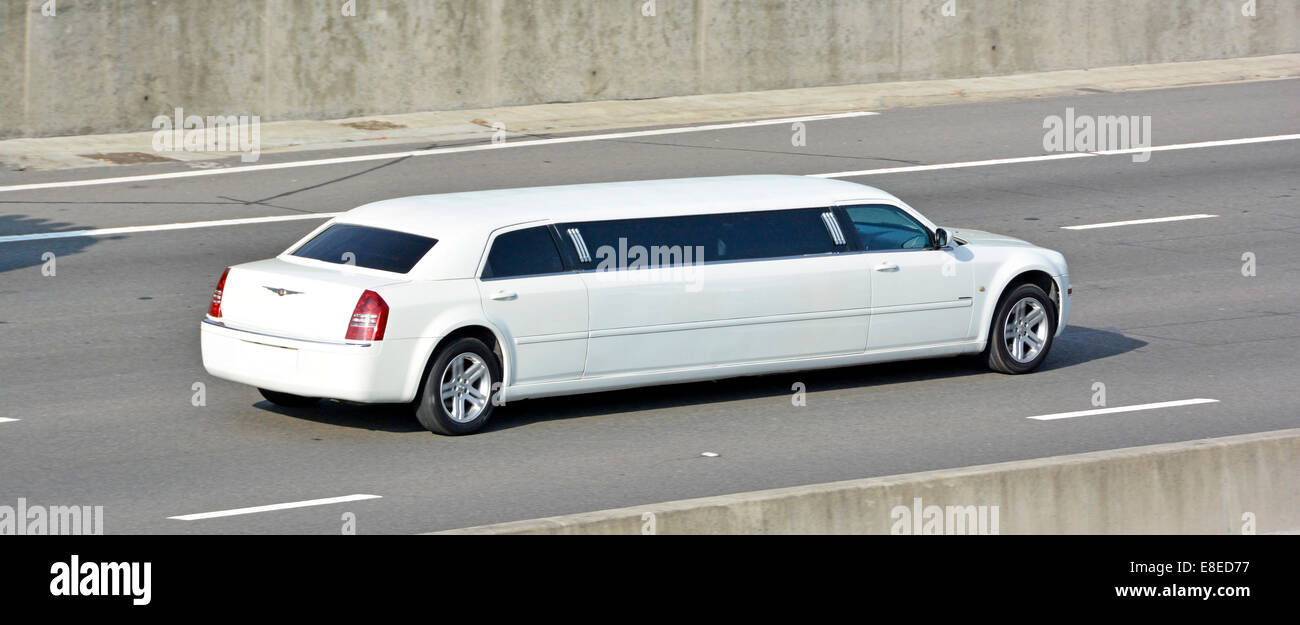 View from above back and side of chauffeur driven luxurious white limousine  motor car travel often called stretch Limo driving along UK motorway Stock  Photo - Alamy