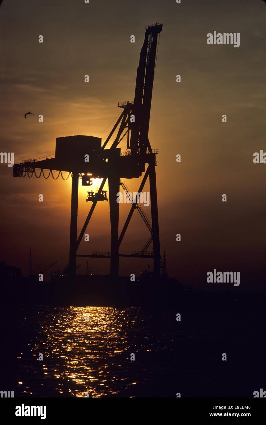 Offshore Platform with Crane at Sunset Stock Photo