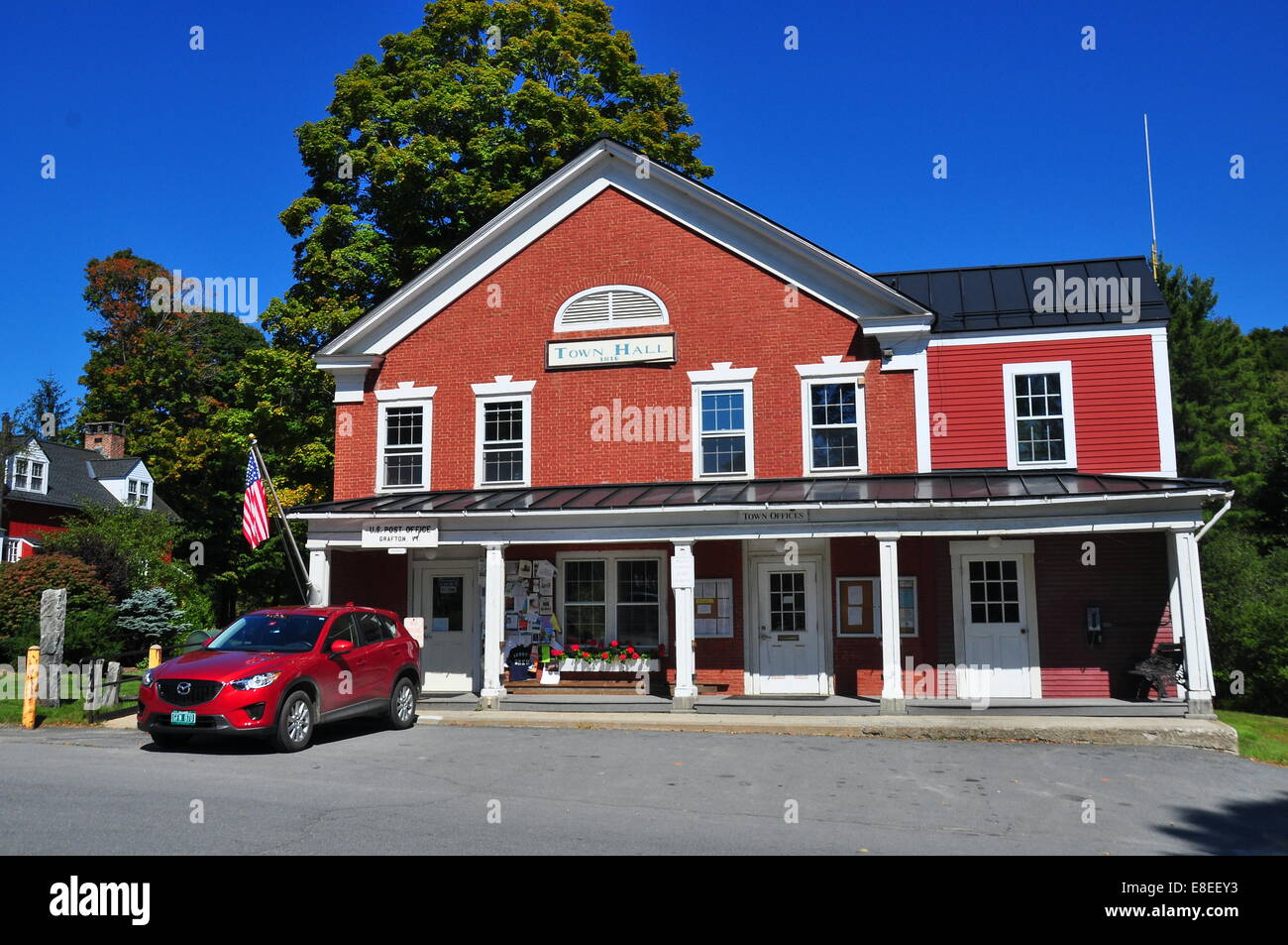 Grafton, Vermont:  A long portico covers the entrances to the 1816 brick Town Hall and United States Post Office * Stock Photo