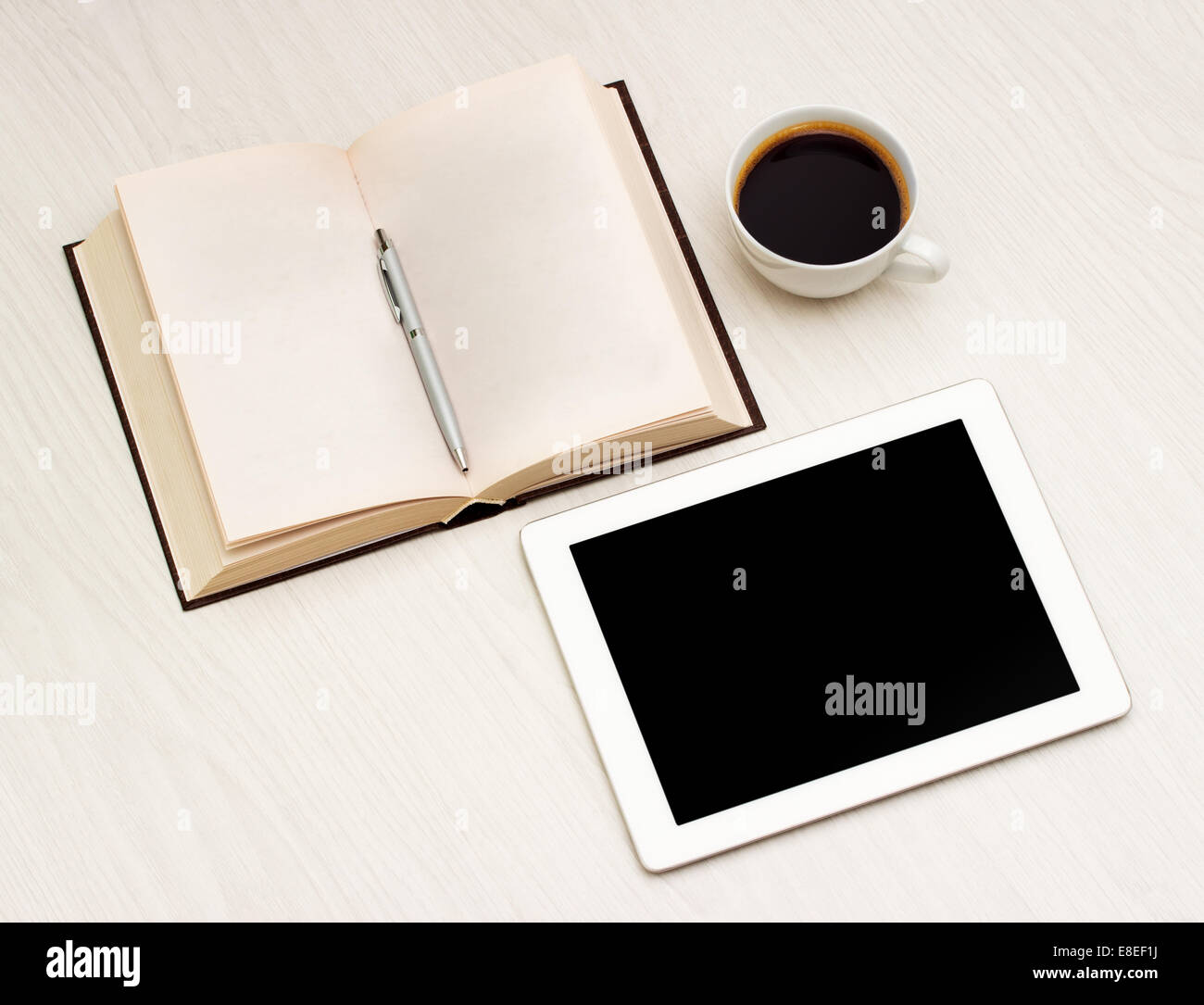 Workplace with a book, tablet and coffee Stock Photo