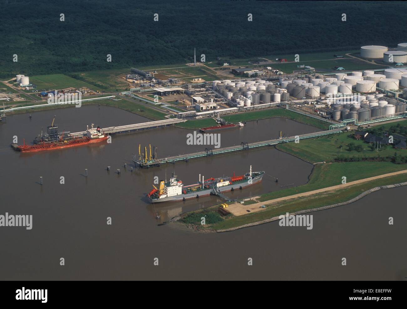 Two Oil Tankers Offloading at Oil Storage Facility Stock Photo