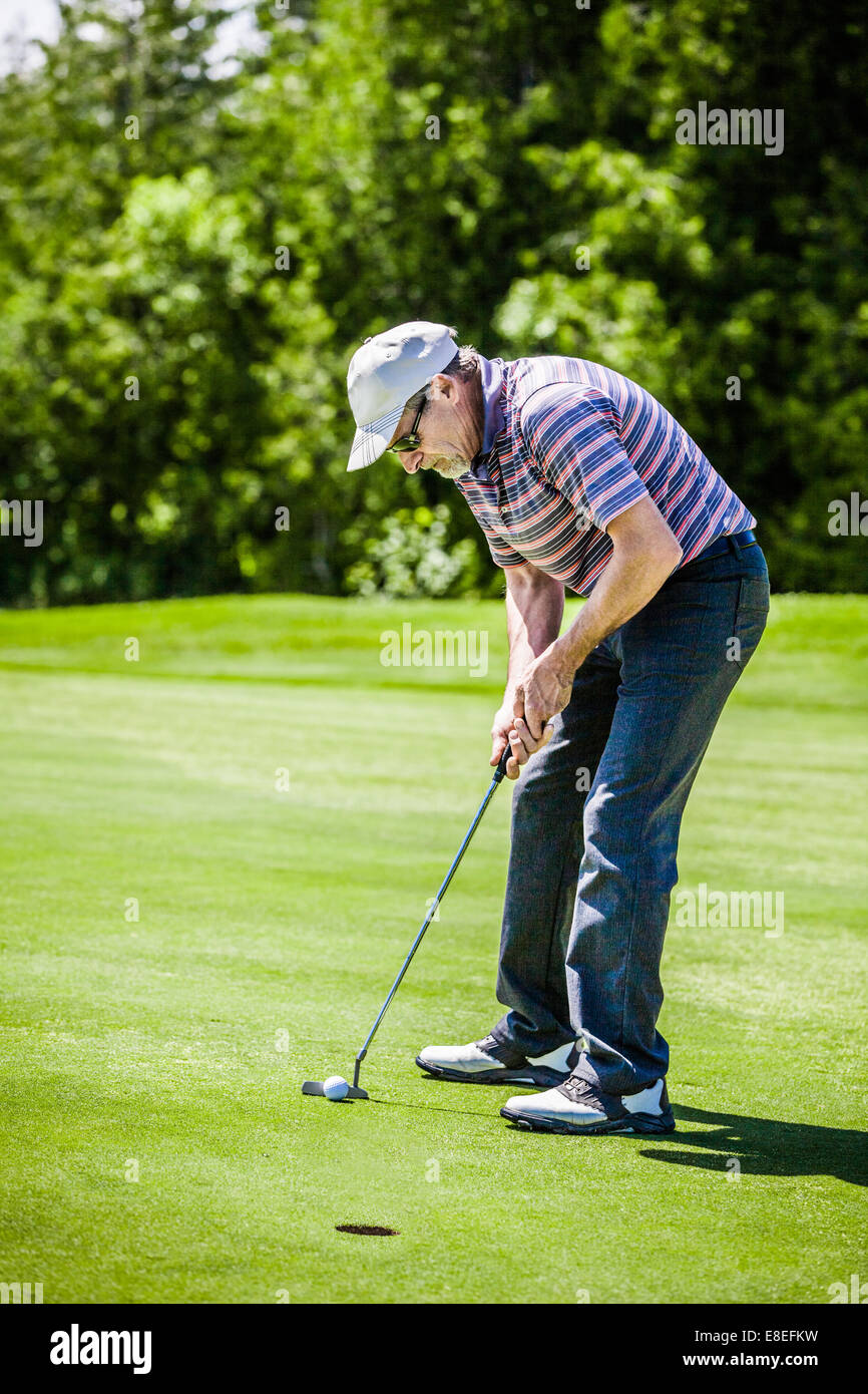 Mature Golfer on a Golf Course Stock Photo