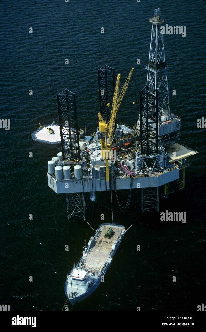 Offshore Oil Drilling Rig with Supply Boat Offloading Stock Photo Alamy