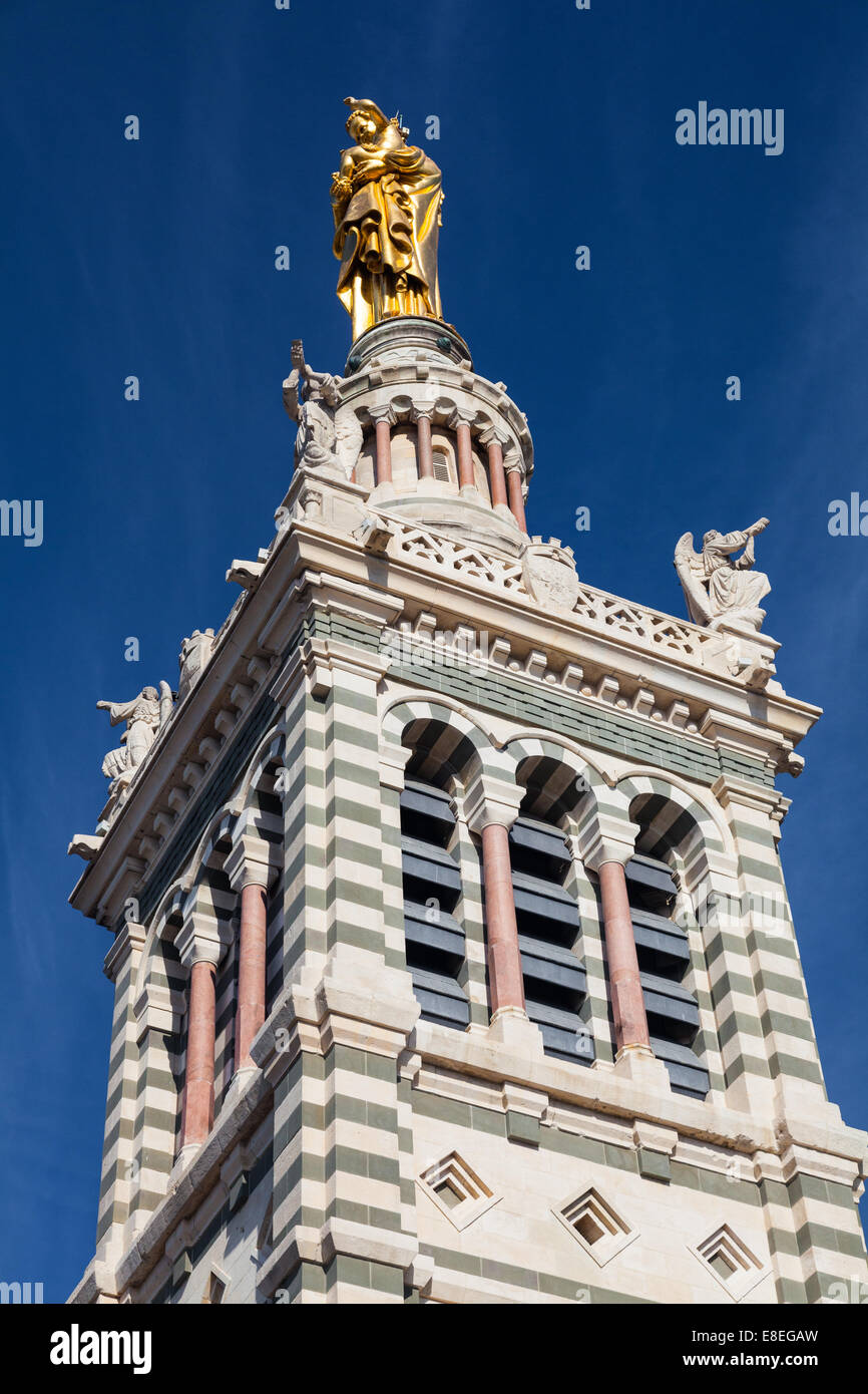 Detail of the upper bell tower of the Notre Dame de la Garde, with the golden Madonna and child Detail of the upper bell tower of the Notre Dame de la Garde, with the golden Madonna and child