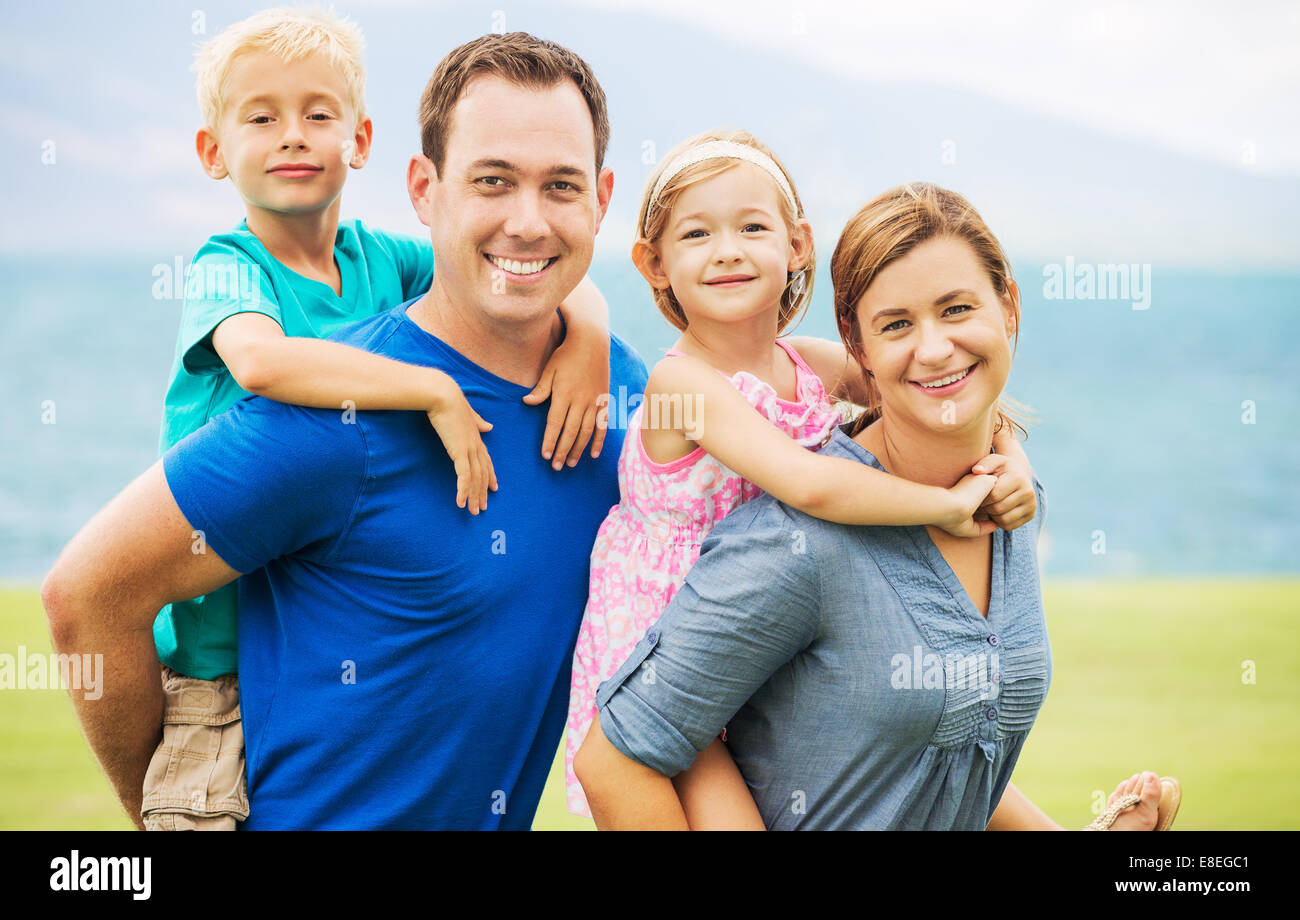 Portrait of Happy Family of Four Outside Stock Photo - Alamy
