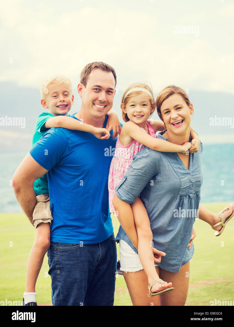 Portrait of Happy Family of Four Outside Stock Photo - Alamy