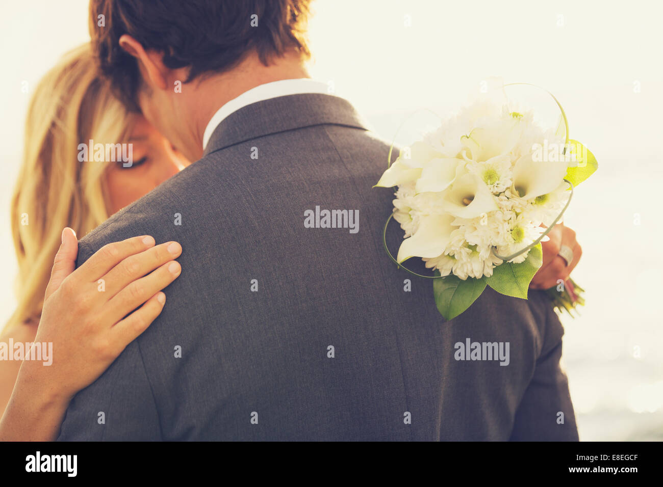 Beautiful Wedding Couple Embracing. Bride and Groom in Love. Stock Photo