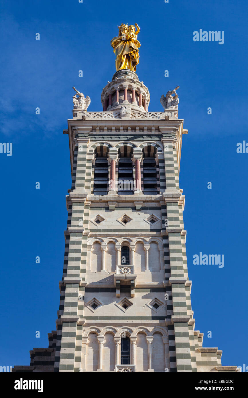 Belltower of the Notre Dame de la Garde, topped with a golden statue of the Madonna and Child, Marseille. Stock Photo