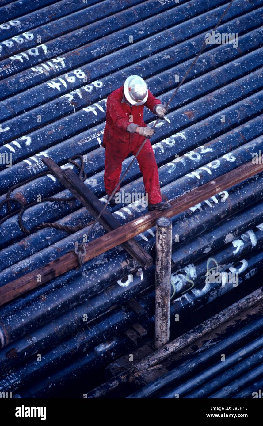 Offshore Oil Drilling Rig Worker Lifting Drill Pipe Stock Photo Alamy