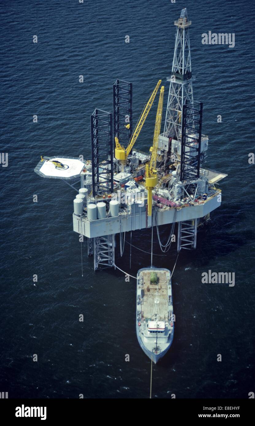 Offshore Oil Drilling Rig with Supply Boat Offloading Stock Photo Alamy
