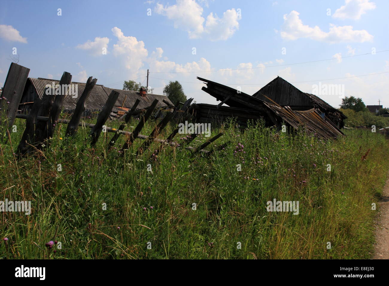 A log house falling apart in village of Serbishino in Ural Mountains, near Ekaterinburg, the third largest city in Russia. Stock Photo