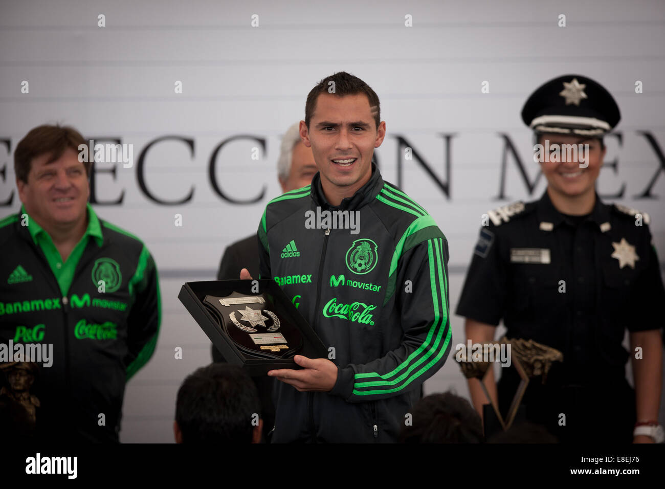 Mexico City, Mexico. 6th Oct, 2014. Mexican national soccer team player Paul Aguilar receives a recognition at the Federal Police Command Center in Mexico City, capital of Mexico, on Oct. 6, 2014. © Pedro Mera/Xinhua/Alamy Live News Stock Photo