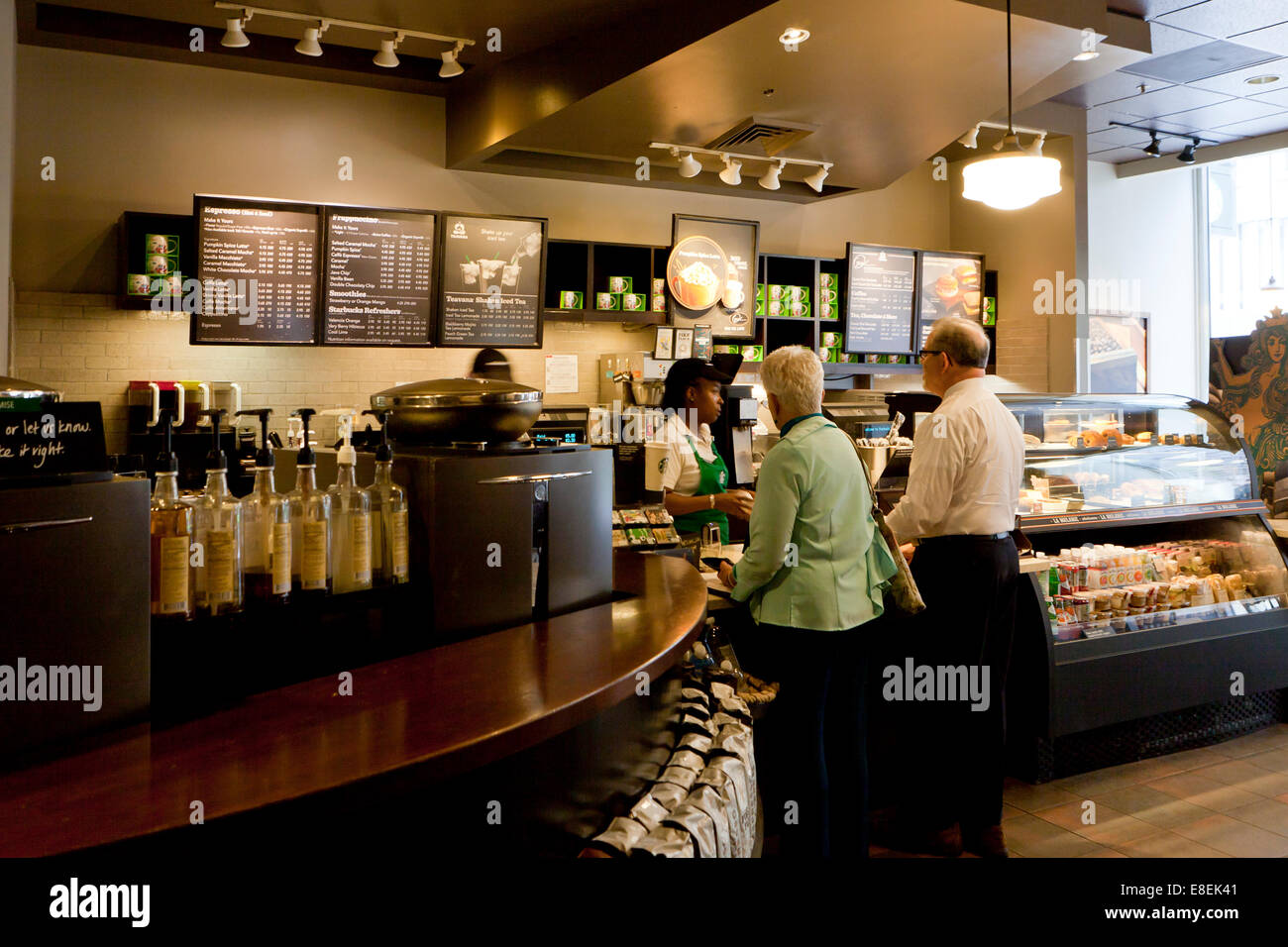 Customers ordering drinks at Starbucks counter - USA Stock Photo