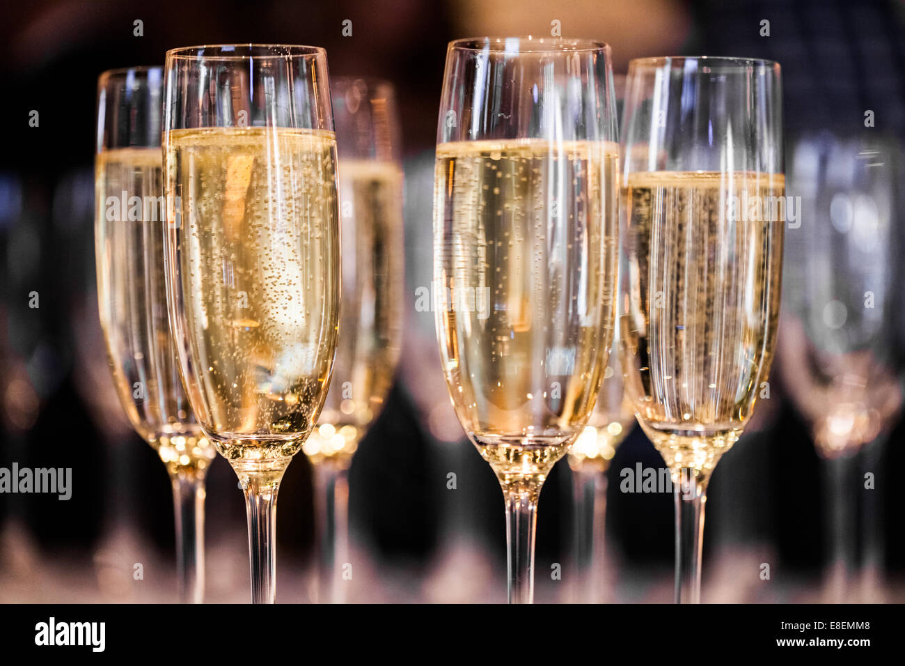 Abstract Champagne Glasses in a restaurant Stock Photo