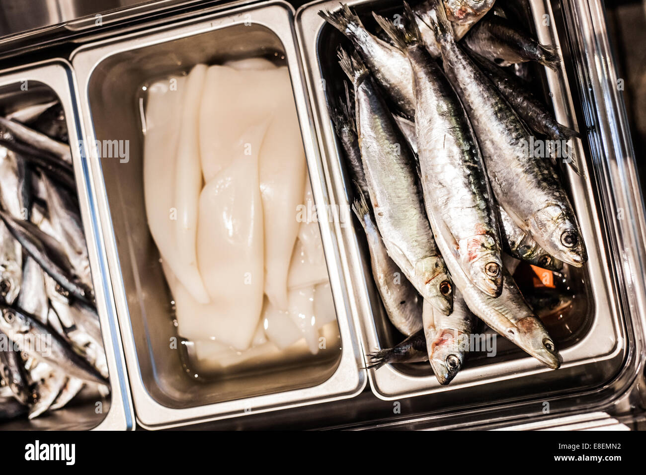 Raw Sardine and Calamare details in a tray of a Portuguese restaurant Stock Photo
