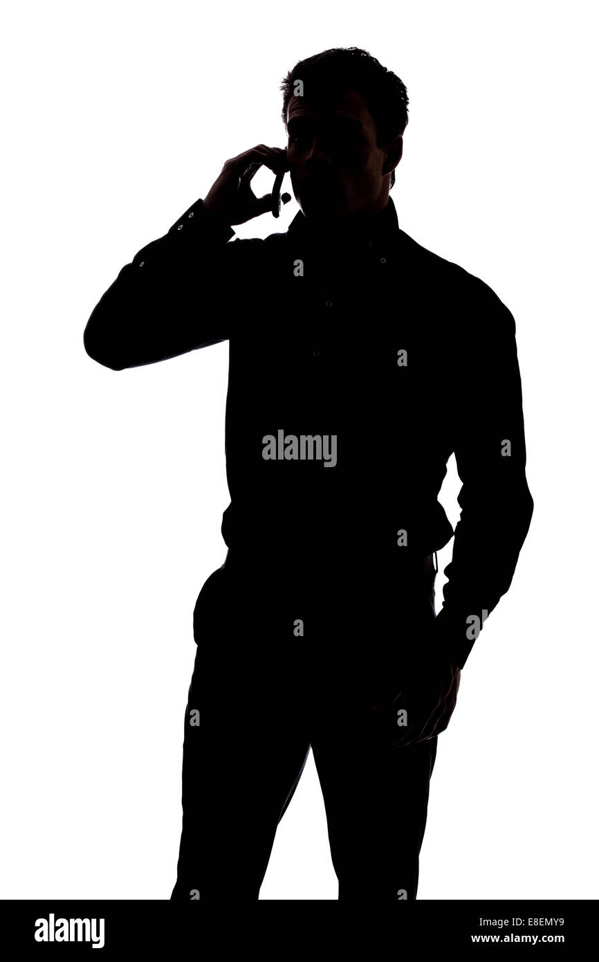 Man talking on cell phone in silhouette isolated over white background Stock Photo