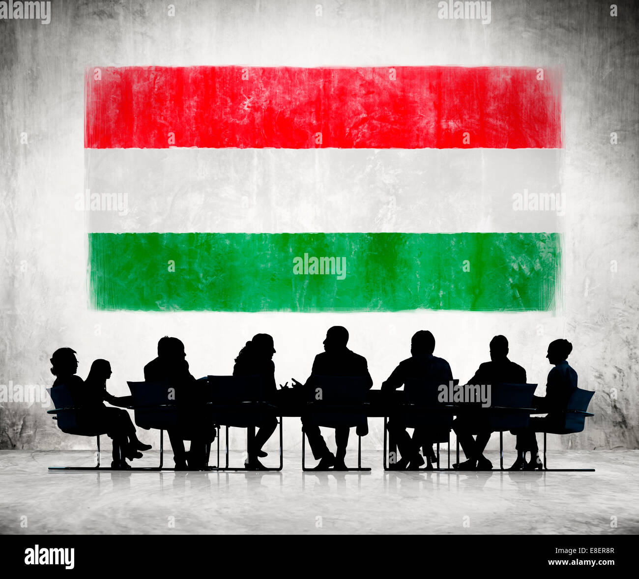 Business People in a Meeting with Hungarian Flag Stock Photo