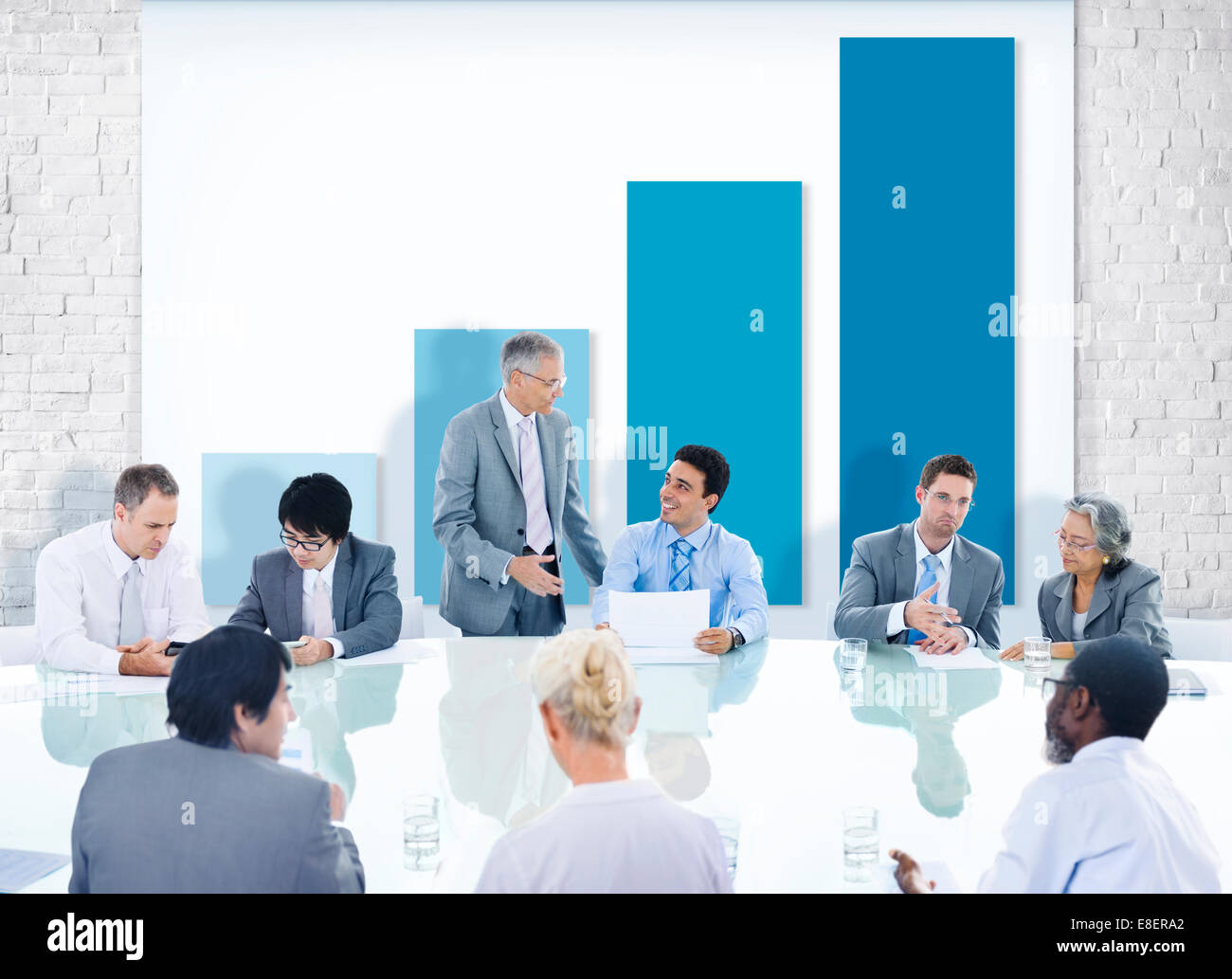 Group of Business People Meeting with Chart Stock Photo - Alamy