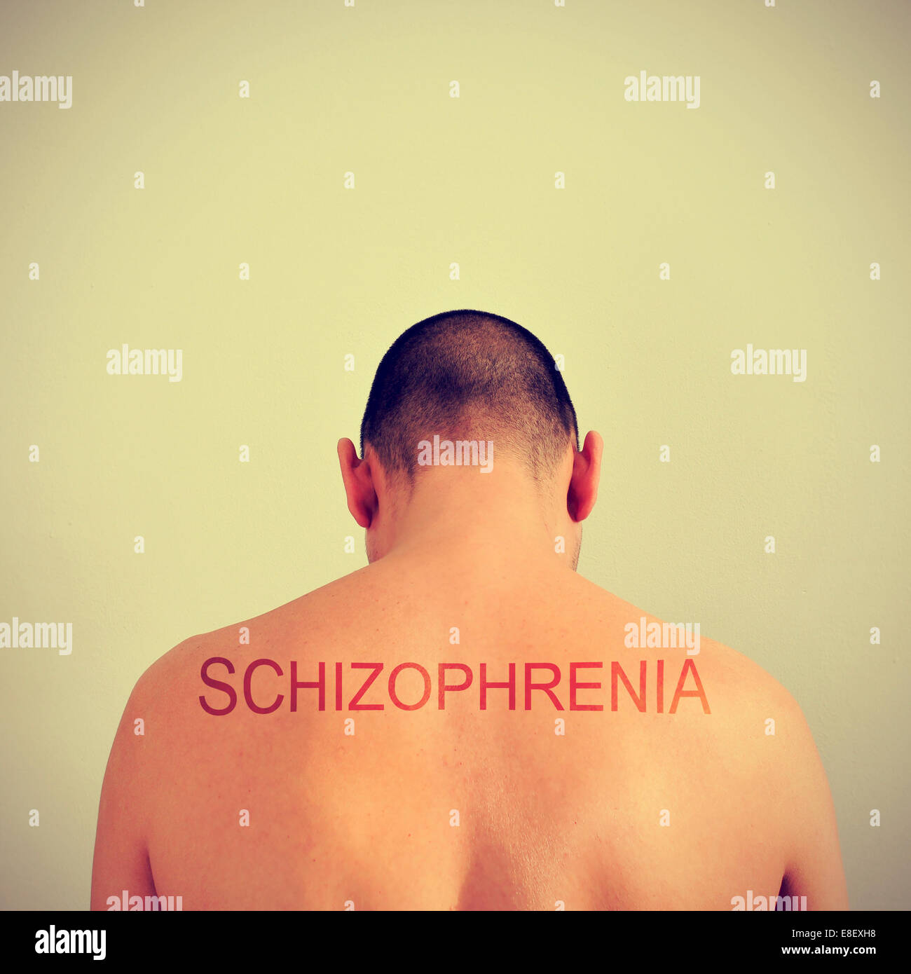 portrait of the back of a young man and the word schizophrenia Stock Photo