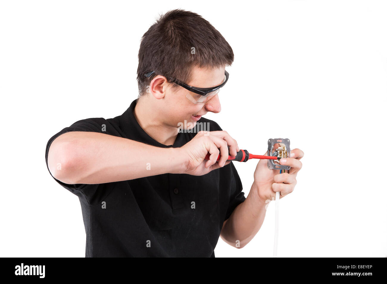 Male serviceman working with cables and electrical outlet Stock Photo ...