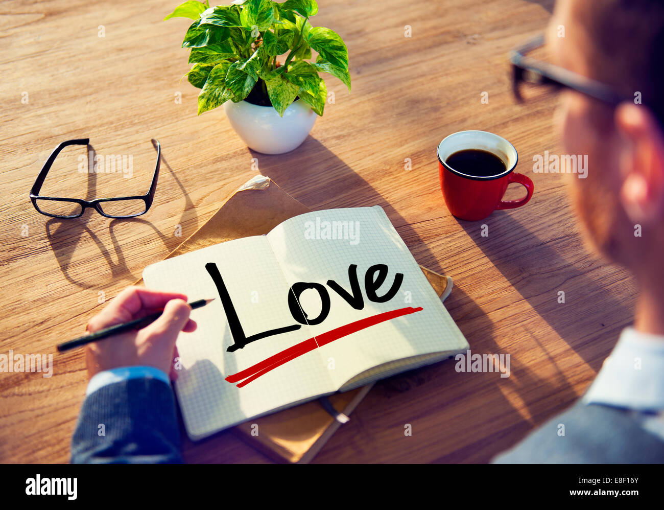 Man with a Note and a Single Word Love Stock Photo