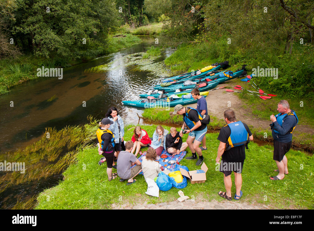 group of young kayakers. Bystrzyca river Kayaking expedition. Poland. Stock Photo