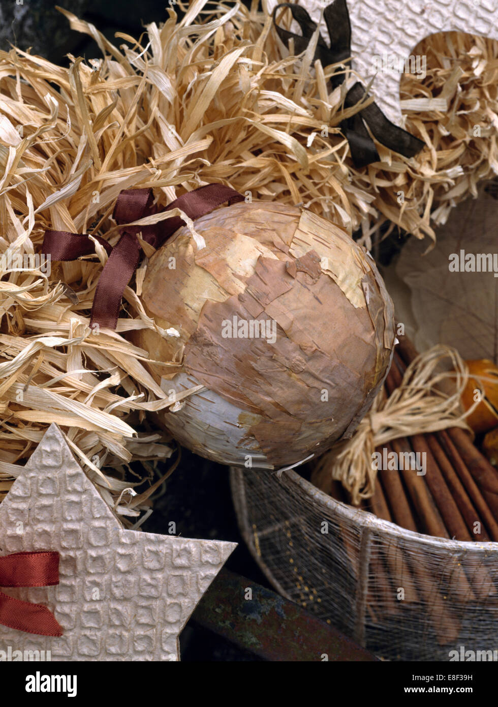 Close Up Of Natural Christmas Wreath Home Made From Raffia With Hand Made Papier Mache Baubles Stock Photo Alamy