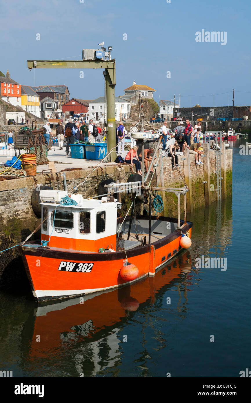 Fishing boat / boats moored / tied up in the sea harbour / Mevagissey harbor in Cornwall. UK. Stock Photo