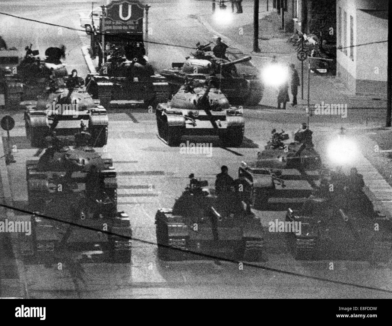 Soviet tanks in the early hours of the morning in East Berlin on 28 October 1961. After an incident at the border crossing-point Friedrichstraße 'Checkpoint Charlie', tanks of the U.S. and the Soviet army drove up on both sides of the border, but withdraw after one day. From 13 August 1961, the day of the building of the Berlin Wall, to the fall of the Berlin Wall on 9 November 1989, the Federal Republic of Germany and the GDR were separated by the Iron Curtain between West and East. Stock Photo