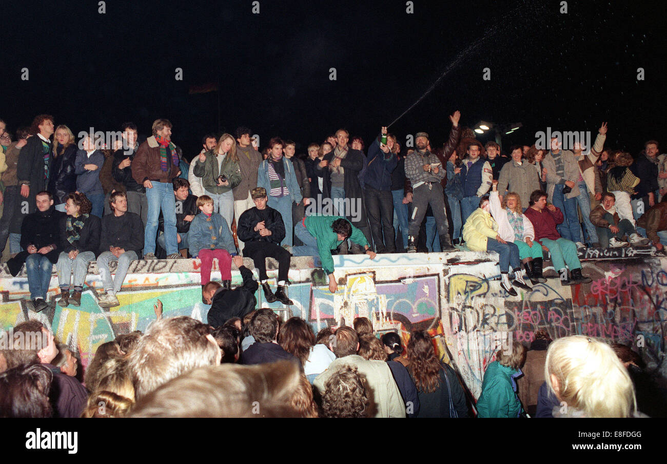 Thousands of people celebrate the Opening of teh Wall in Berlin, Germany, 10 November 1989. Photo: Peter Zimmermann Stock Photo