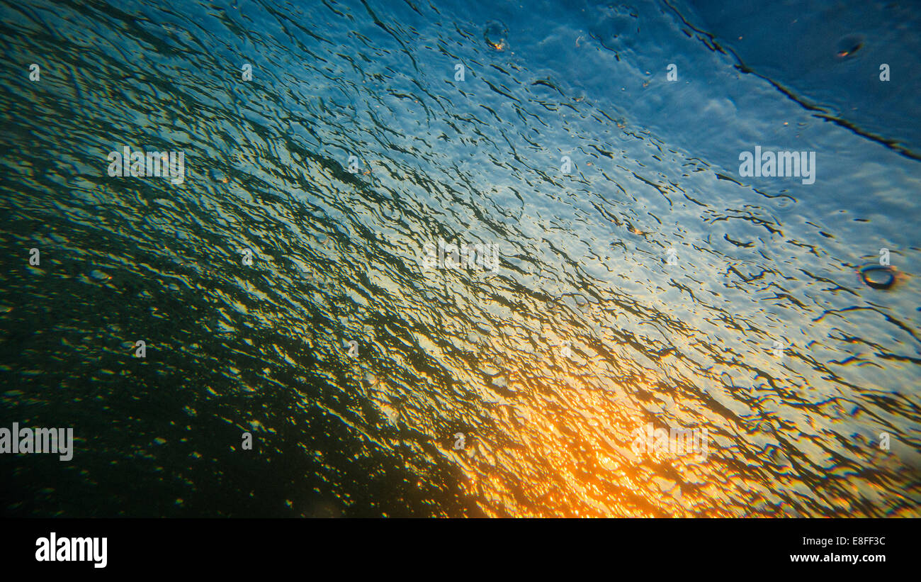 Close-up of sunrise reflected in Pacific Ocean Stock Photo