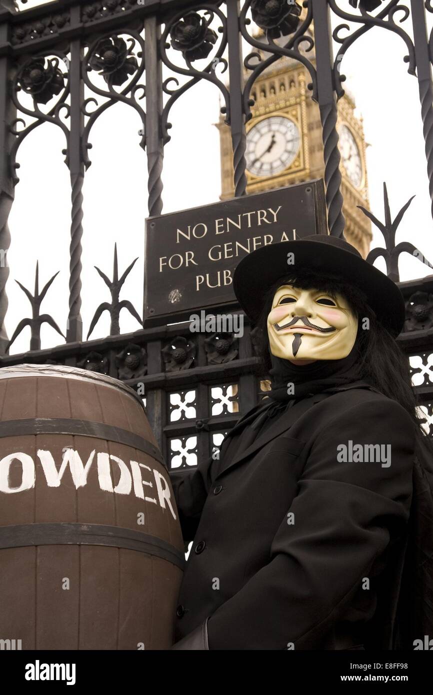 Demonstrator dressed as Guy Fawkes outside Parliament protesting against Members of Parliament and their expenses Stock Photo