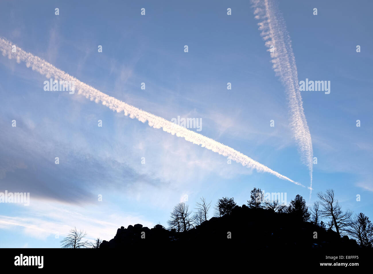 Contrails in sky Stock Photo