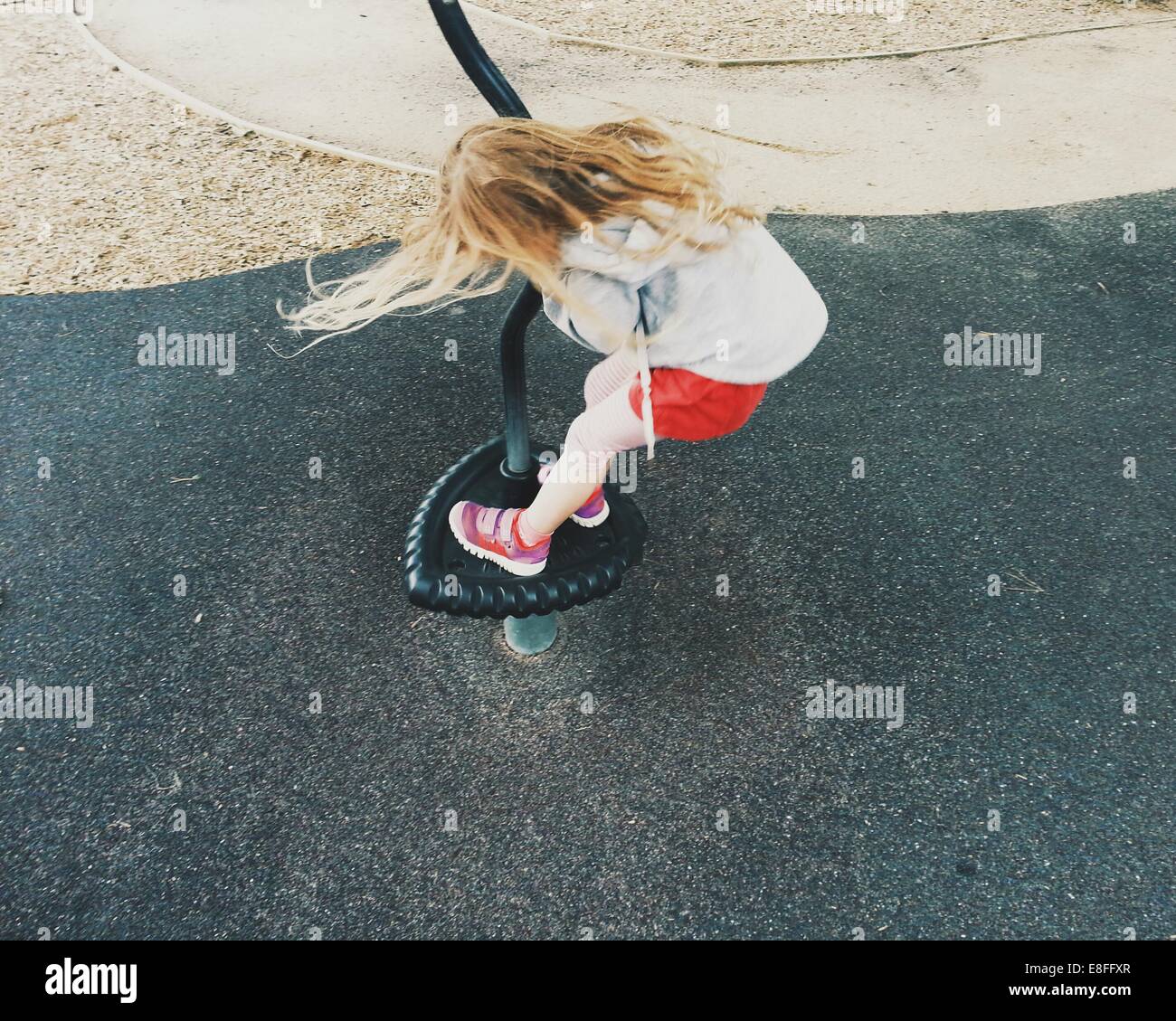 Girl playing at playground Stock Photo