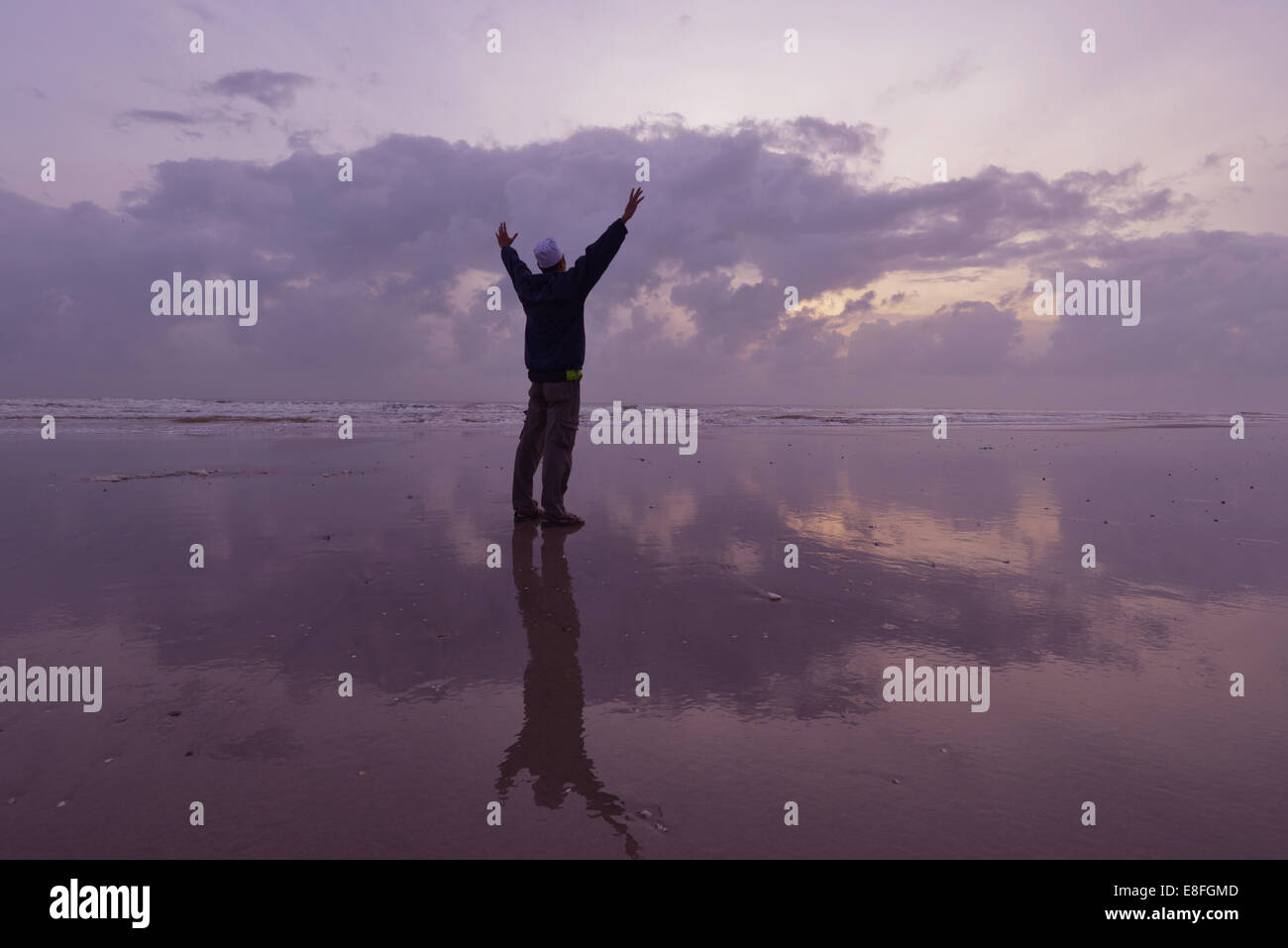 Malaysia, Kuantan, Silhouette of man on beach at morning day Stock Photo