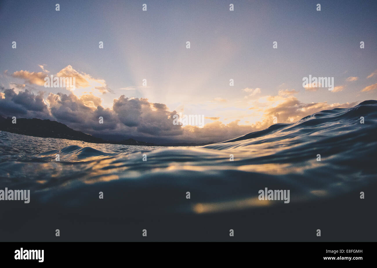 Water surface of ocean at sunset, Hawaii, United States Stock Photo